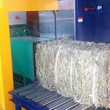 Baler Strapping in Agricultural Haystacks